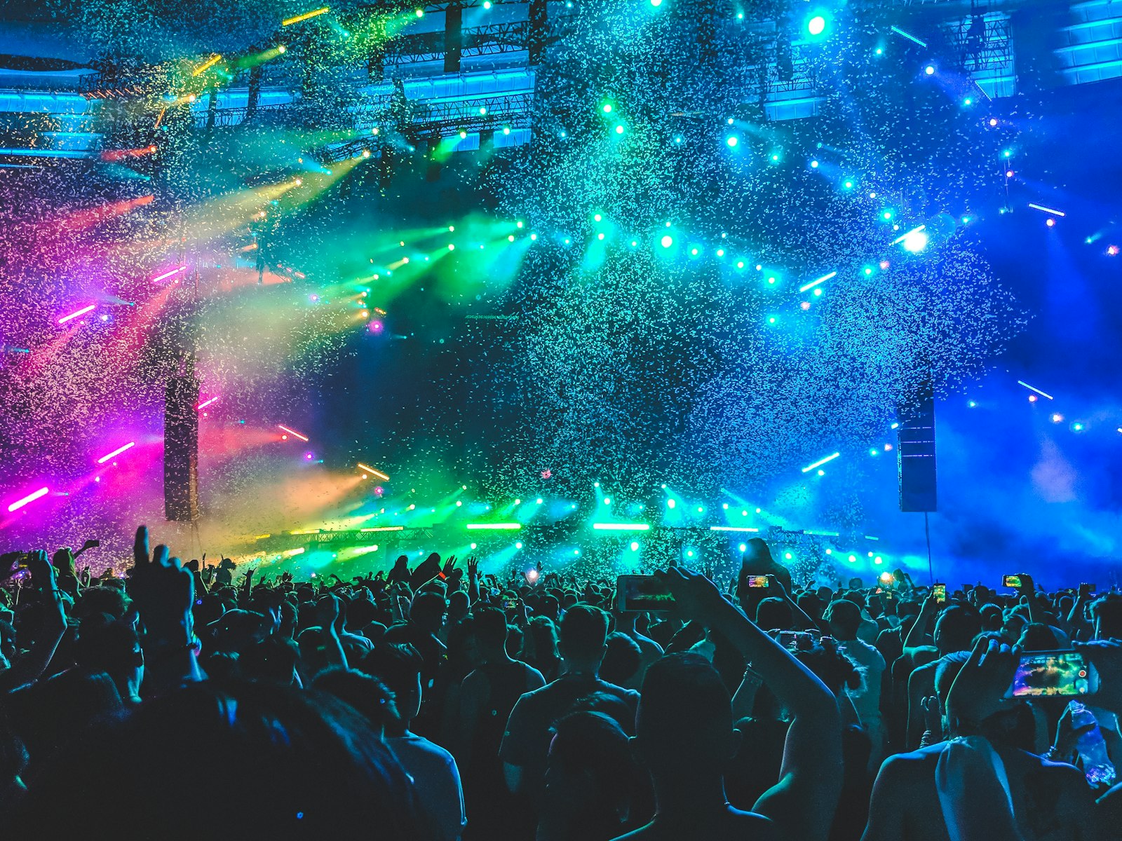 Trap house rave crowd with neon lights